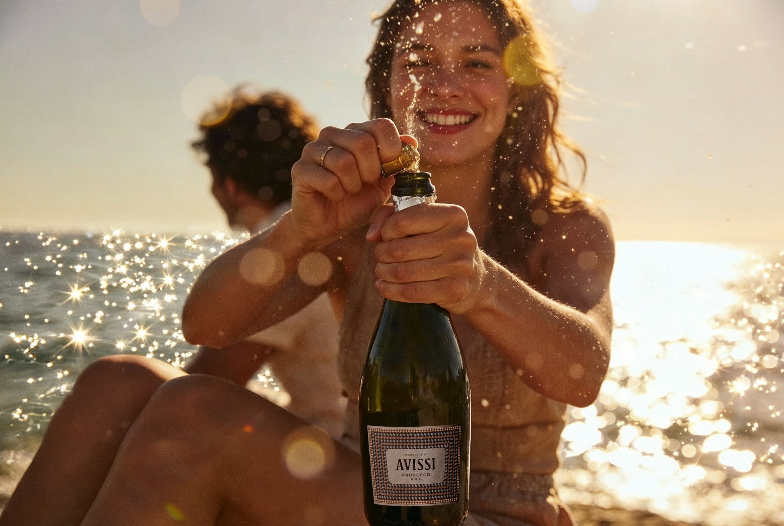 Two people on the water with a bottle of Avissi Prosecco